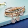 Elegancka trzyczęściowa bransoletka - z kryształowymi sercami - srebrno - złoto - różowe złotoBransoletki