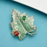Luksuriøs krystallbrosje - rød bille / grønt blad