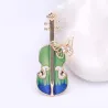 Snygg brosch med gitarr & kristallfjäril
