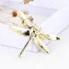 Fasjonabel vintage brosje - med krystall øyenstikker
