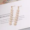 Elegant long golden earrings - geometric metal with pearlsEarrings