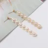 AretesPendientes largos dorados elegantes - metal geométrico con perlas