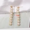 Elegante lange gylne øredobber - geometrisk metall med perler