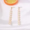 AretesPendientes largos dorados elegantes - metal geométrico con perlas
