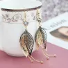 Hollow leafs long earrings - with zircon / pearlsEarrings