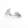 Kalvosinnapit vihreällä joulukuusella