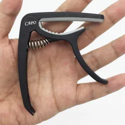 Plastic guitar capo - for 6-string instrumentGuitars