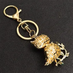Gylden krystallugle - grønne blader - nøkkelring