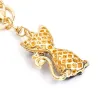 Gato cristal - chaveiro dourado