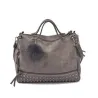 Vintage Tasche aus Nubukleder mit Nieten / Fellbommel