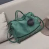 Vintage Tasche aus Nubukleder mit Nieten / Fellbommel