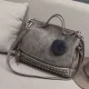 Vintage Tasche aus Nubukleder mit Nieten / Fellbommel
