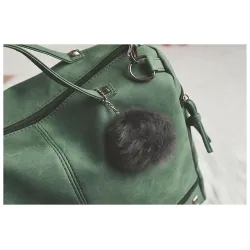 Vintage Tasche aus Nubukleder mit Nieten / Fellbommel