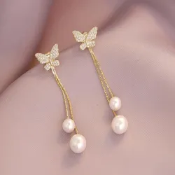 Boucles d'oreilles longues dorées - papillon / perles