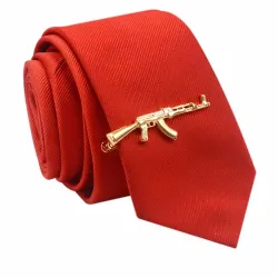 Pistolet doré - pince à cravate