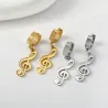 Lange øredobber med musikknoter