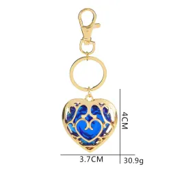 Coeur en cristal dans cage dorée - porte-clés