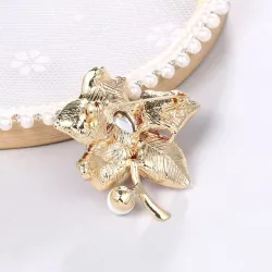 Flor com cristal/pérola - broche dourado