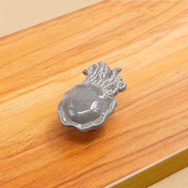 Keramiske møbelhåndtak - knotter - blekksprutformet