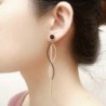 Boucles d'oreilles longues pompons - or rose / émail noir - acier inoxydable