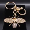 Porte-clés doré avec une abeille en cristal