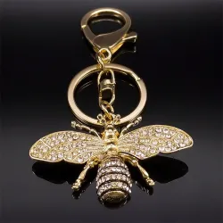 Porte-clés doré avec une abeille en cristal
