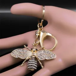 Porte-clés doré avec une abeille en cristal