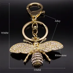 Porte-clés doré avec une abeille en cristal