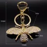 Porte-clés doré avec une abeille en cristal