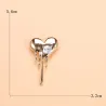 BrochesBroche en forma de corazón con circonitas