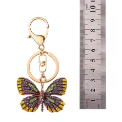 Chaveiro dourado com borboleta de cristal