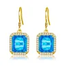 Boucles d'oreilles dorées avec topaze cristal bleu / strass
