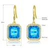 Boucles d'oreilles dorées avec topaze cristal bleu / strass