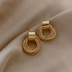 Elegante gyldne runde øredobber - flere sirkler