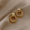 Elegante gyldne runde øredobber - flere sirkler