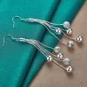 Pitkät hopeiset korvakorut - ketjut helmillä