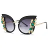 Moderigtige cat eye-solbriller - dekorative blade / krystaller