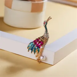 Grue en cristal avec perle - broche