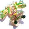 Grenouille en cristal coloré - broche dorée