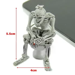 Skeleton istuu wc - kumi avaimenperä