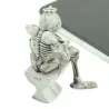 Skeleton istuu wc - kumi avaimenperä