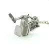 Skeleton sitting on the toilet - rubber keychainKeyrings