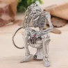 Skeleton istuu wc - kumi avaimenperä