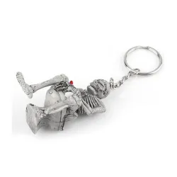 Skeleton istuu wc - kumi avaimenperä