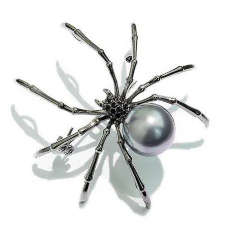 Sort edderkop med perle - elegant broche