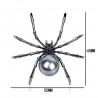 Svart spindel med pärla - elegant brosch