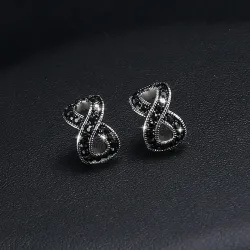 AretesPendientes de infinidad de cristal negro