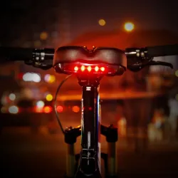 Bicycle saddle with warning light