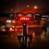 Sela de bicicleta com luz de aviso