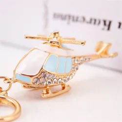 Helicóptero de cristal dourado - chaveiro
